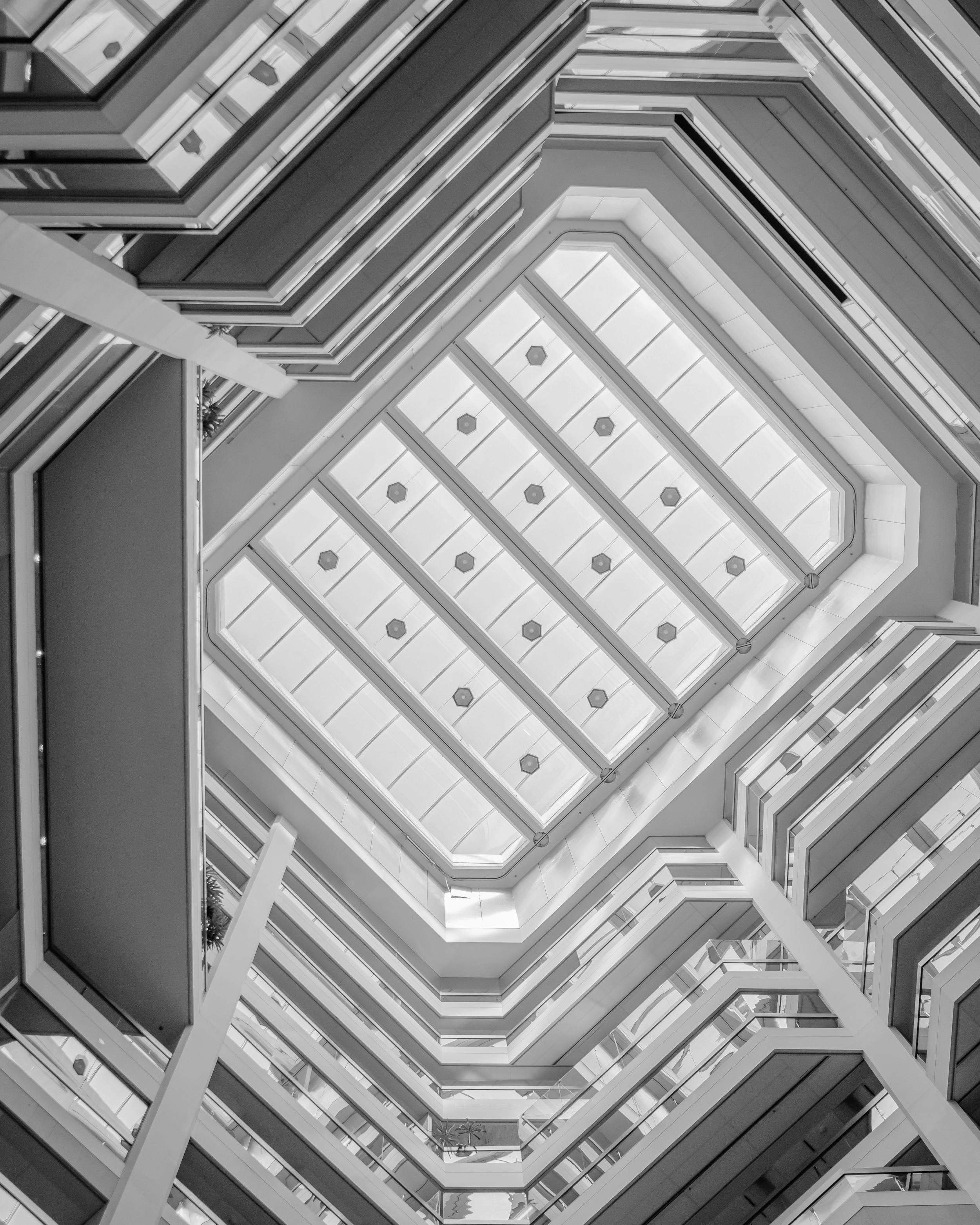 view of ceiling of a tall multi-floor building